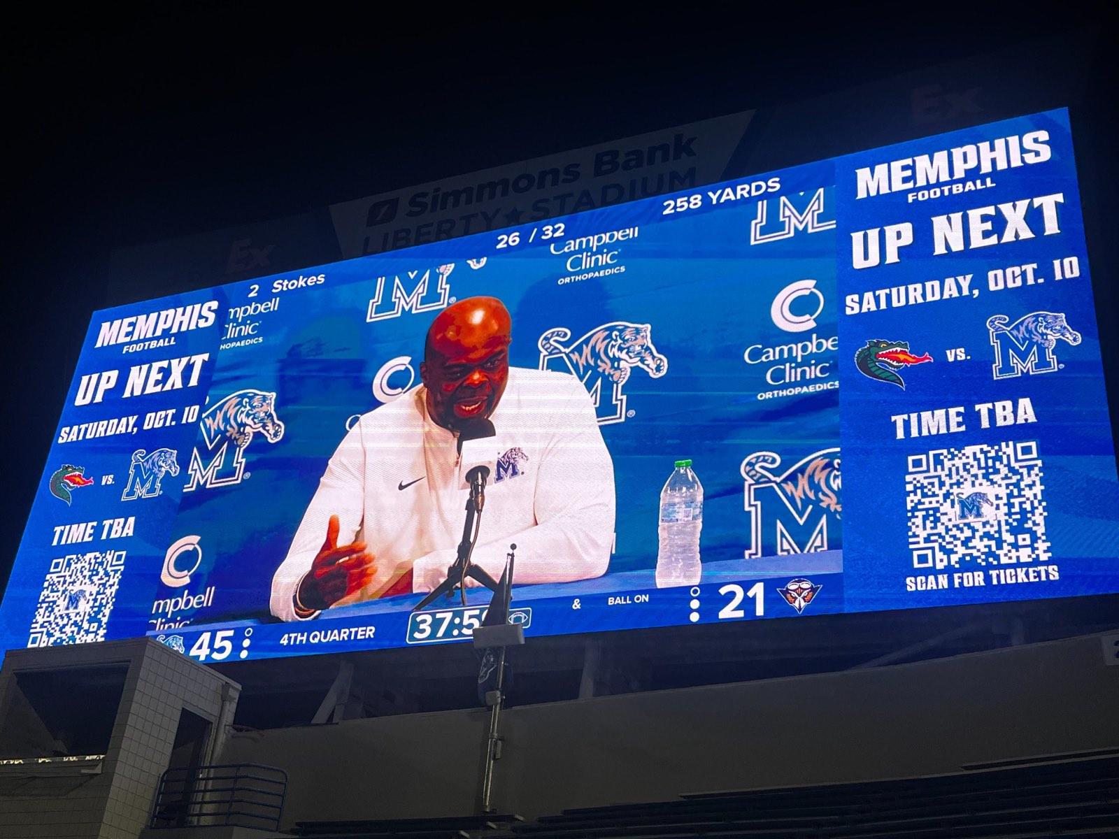 Coach Charles Huff on the stadium video board beside Marcus Stokes' 26-of-32, 258-yard passing statistics